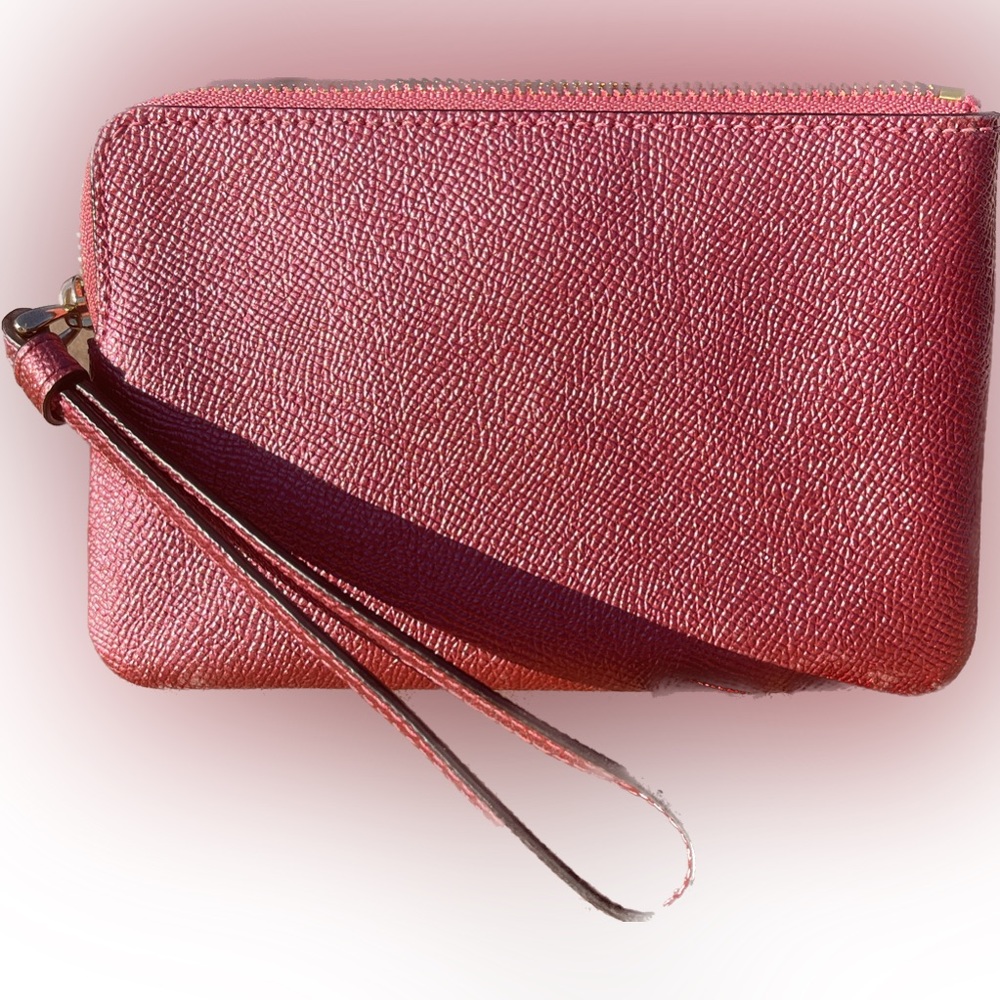 Coach medium pouch, pink, 6.25” x 4”. Excellent used condition.